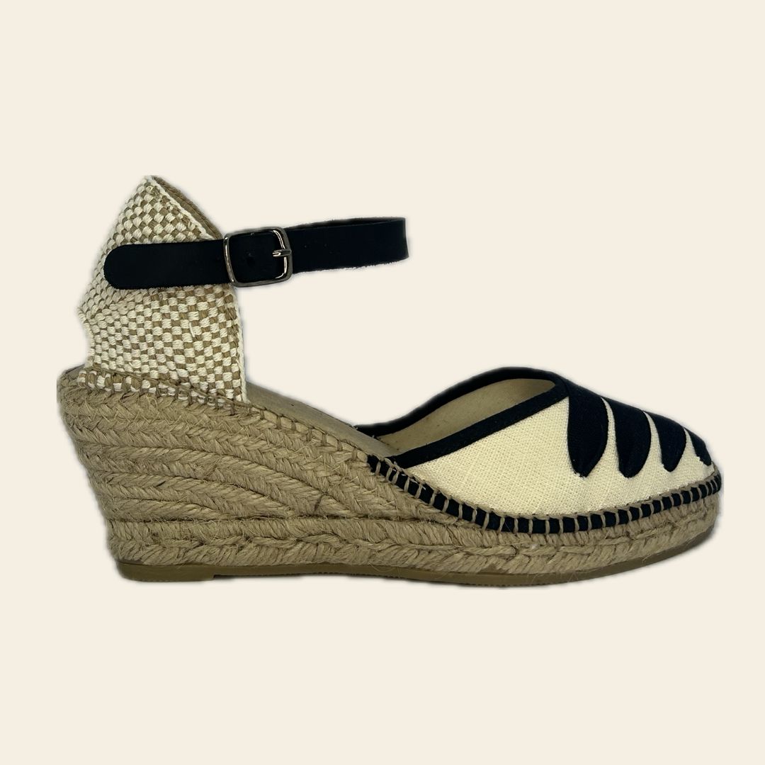 Pair of handmade espadrilles featuring a surrealist design inspired by Salvador Dalí, titled "Gala".